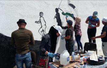 من مبادرة ارسم فلسطين على جدران المخيم