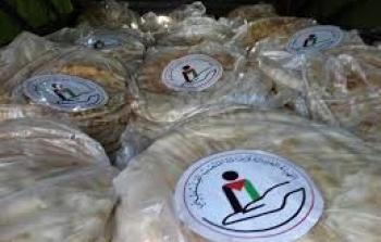 الهيئة الخيرية توزع الخبز على أهالي مخيم خان الشيح