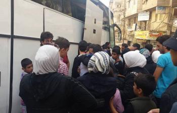 بدء خروج المقاتلين وعائلاتهم من بلدتي قدسيا والهامة (دمشق الان)