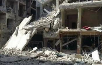 أحد المباني التي دمرها القصف في اليرموك