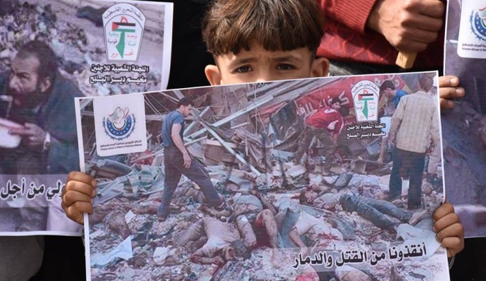غزة- خلال الوقفة التضامنية مع أهالي مخيم خان الشيح