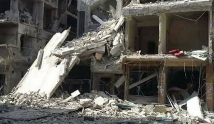 أحد المباني التي دمرها القصف في اليرموك